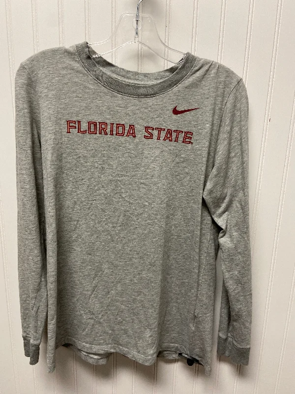 Top Long Sleeve By Nike In Grey, Size: M